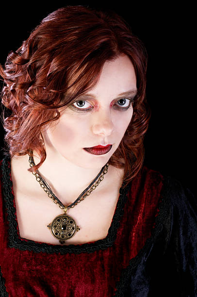 istock Young woman made up as a vampire on black background 171574984