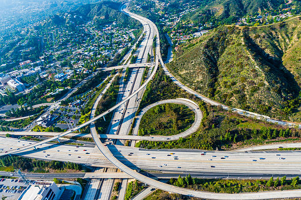 istock Los Angeles freeways and interchange aerial panorama 171575184
