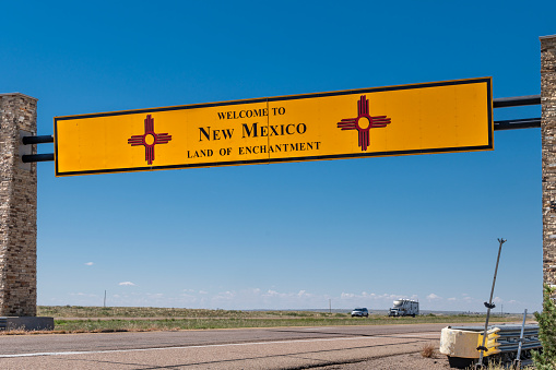 The New Mexico Welcome sign suspended over Interstate 40 in the westbound lanes at the border with the U.S. state of Texas.