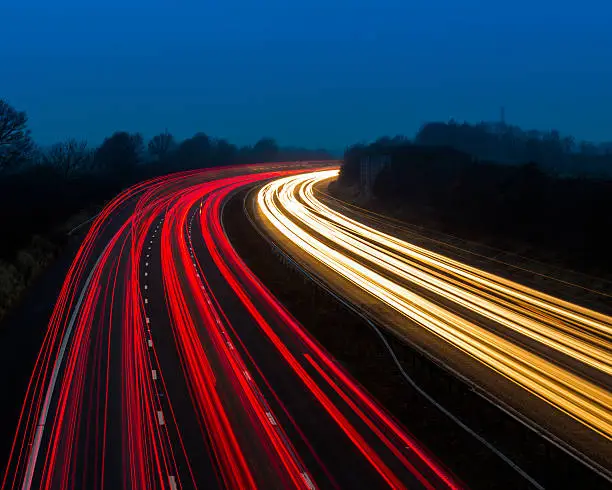 Busy rush hour traffic on the M6 Motorway in England, taken at dusk.