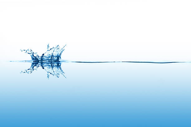 Smal splashing on calm surface of the water