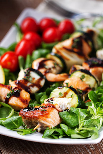 istock Fish skewers with salad 171575407