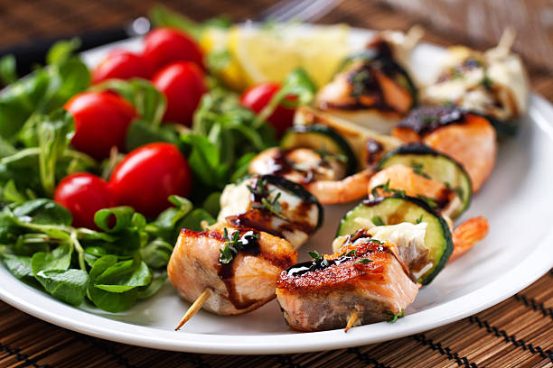istock Fish skewers with salad 171575410