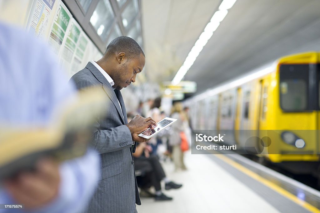 connected in the subway young man checking his emails in the subway Train - Vehicle Stock Photo