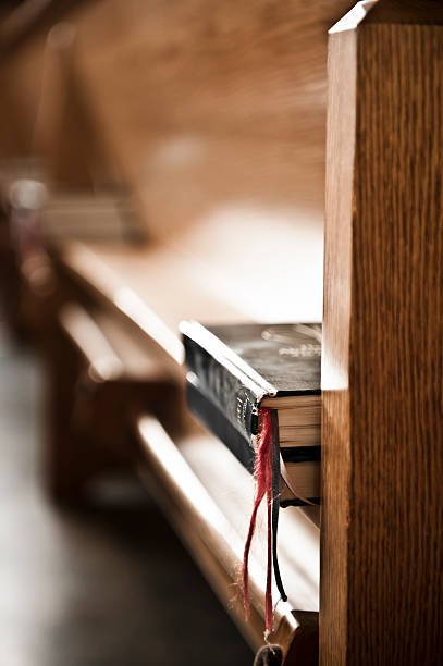 Books at a Church Some books on a bench in a church.More from the same shoot: pew stock pictures, royalty-free photos & images