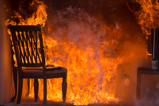 Living Room On Fire.  This stock image has a horizontal composition.