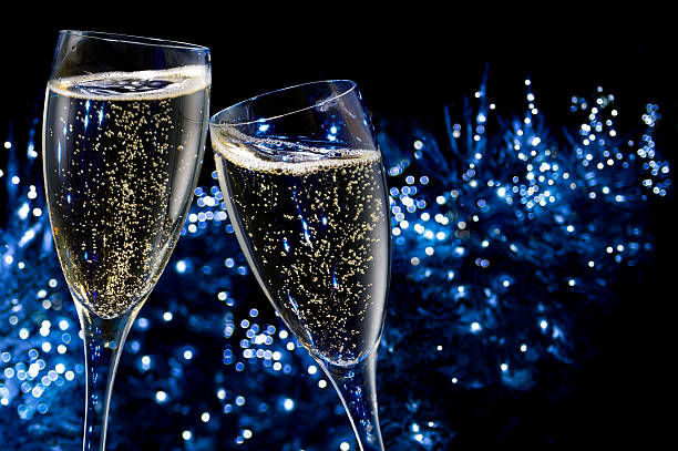 brindando con champagne - champagne celebration glass black foto e immagini stock