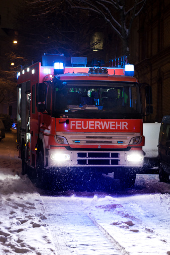 A german firetruck standing on an icy road - long exposure
