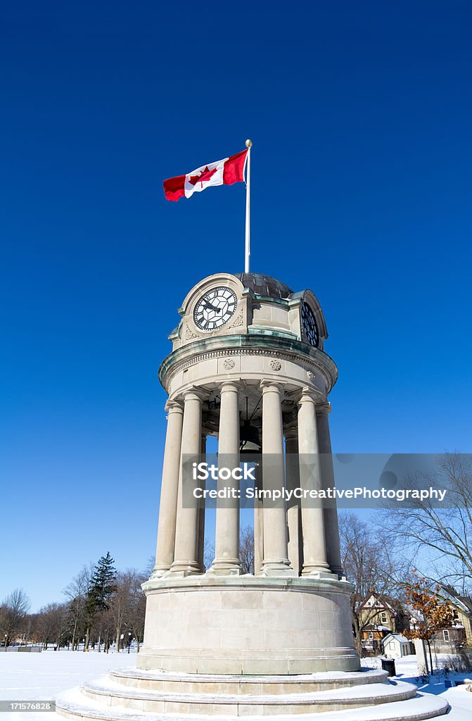 Clock Tower The clock tower in Kitchener's Victoria Park with the Canadian Flag against a brilliant blue sky.Similar Images: Kitchener - Ontario Stock Photo