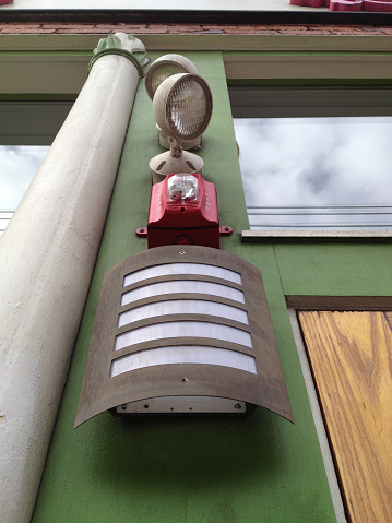 Fire alarm and security lights as seen from below.   Photographed with an iPhone.