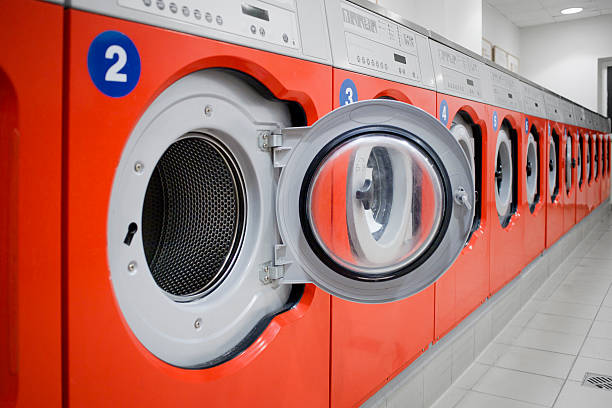 istock Open washing machine in a public laundromat 171577453