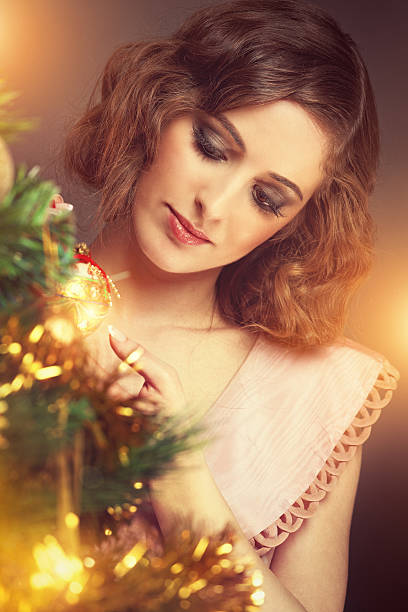 istock retro girl decorating a christmas tree 171577563