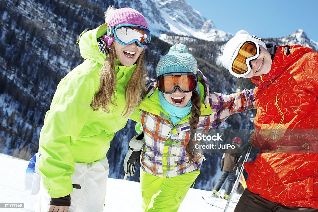 Winter fun Happy friends at ski resort Adult Stock Photo