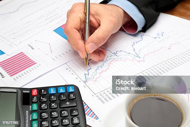 Business Meeting Mans Hands Pointing On Graphs Stock Photo - Download Image Now - Bank Account, Business, Business Meeting