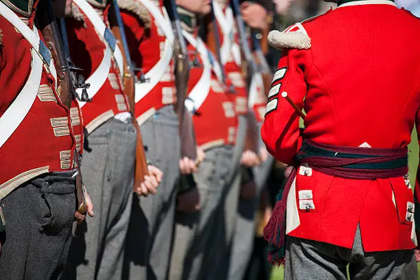 A group of military re-enactment enthusiasts in the red-coated uniform of British soldiers as worn during the Napoleonic Wars between 1812 and 1816.Related Images:
