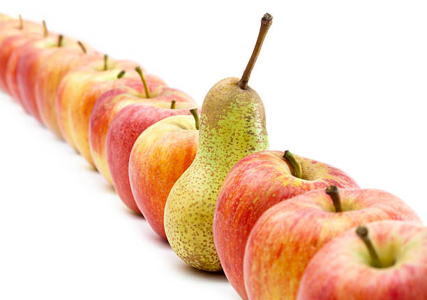 istock Many Apples In A Row And One Pear 171578234