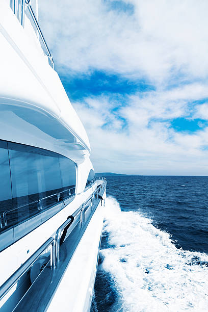 Motor Yacht Sailing at High speed. Blue toned