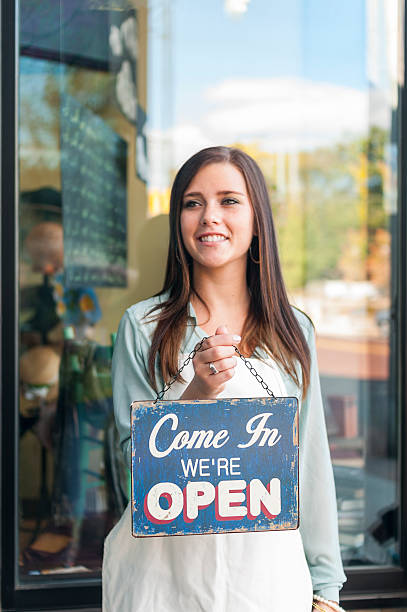 istock Woman with Open Sign 171578516