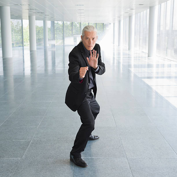 istock Businessman In Martial Arts Fighting Stance 171578557