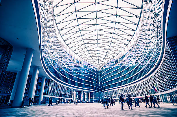 People in a contemporary building architecture Contemporary building architecture in Milan, Italy. Tilt shift effect.View my lightbox: lombardy photos stock pictures, royalty-free photos & images