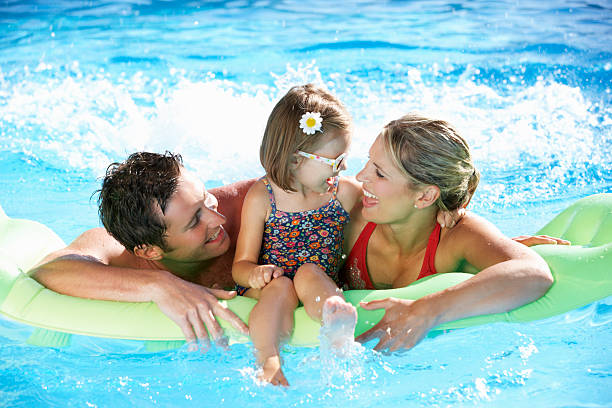 A family having fun in the swimming pool