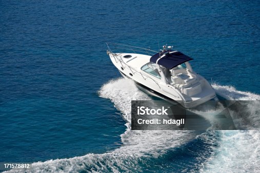 istock White motorboat making waves on blue water 171578812