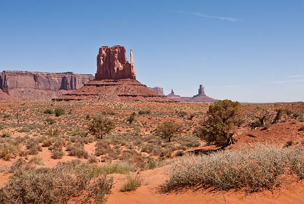 West Mitten and Sentinal Mesa Located on the Arizona/Utah border at an elevation of 5200 feet, Monument Valley is filled with unique sandstone formations. This scene is of the iconic West Mitten and Sentinal Mesa. Monument Valley Tribal is located near Oljato, Utah, USA. jeff goulden monument valley stock pictures, royalty-free photos & images