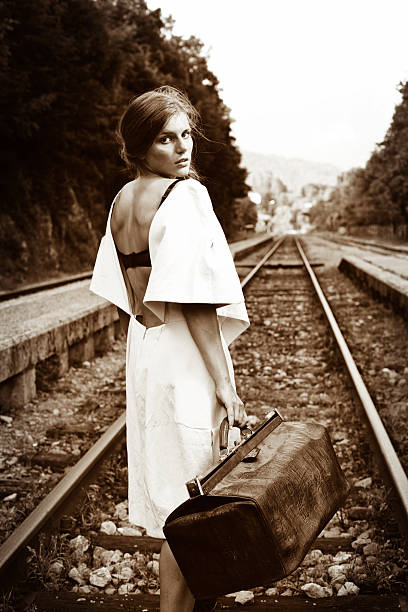 istock Attractive long haired brunette at railway station 171578965