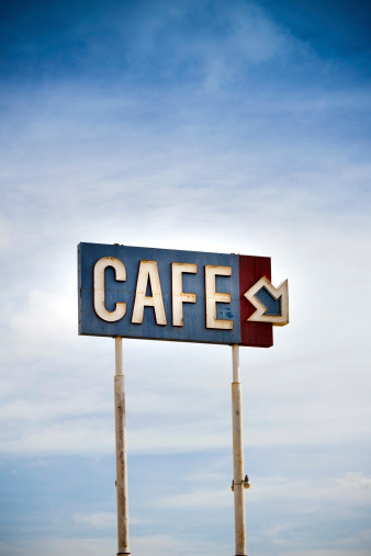 Photo of an old billboard of a cafetiere