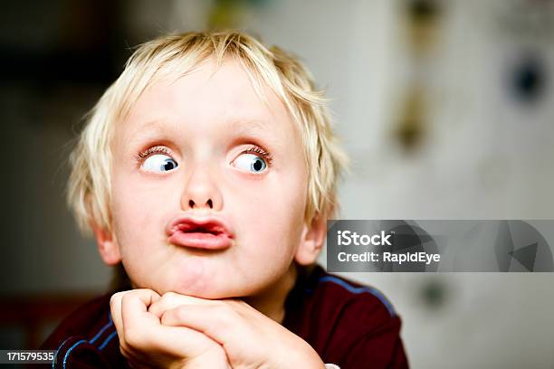 Sevenyearold Boy Rolls His Eyes To The Right Stock Photo - Download Image Now - Child, Rudeness, Boys