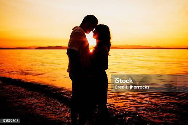 Romantic Couple Silhouette At Sunset Stock Photo - Download Image Now - Couple - Relationship, Beach, Rubbing Noses