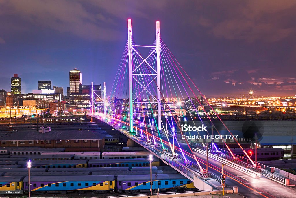 Nelson Mandela Bridge sunset Multicolored lighting on Nelson Mandela Bridge in Johannesburg city. Johannesburg Stock Photo