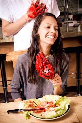 young female eating a man's heart out