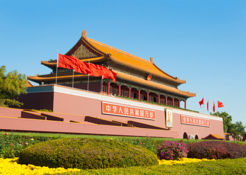 Chinese national flag in front of the Forbidden city in Beijing, China