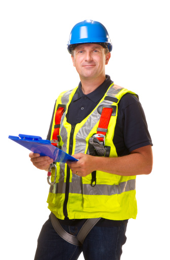 mature adult construction worker with access safety harness