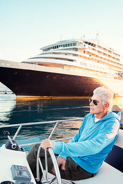 istock Handsome man driving the boat 171580105