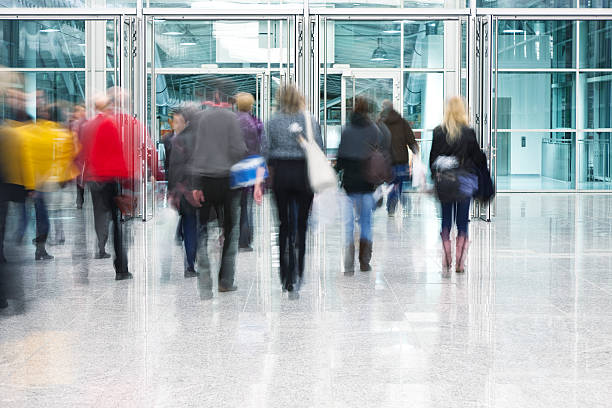 istock Blurred Commuters Walking Through Glass Doorway 171580182