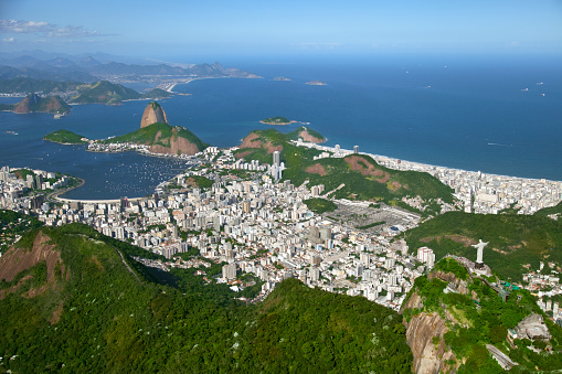 Christ the Redeemer (right), Sugarloaf (left), Copacabana Beach (right middle), Botafogo district (center), Niteroi city (background), Atlantic Ocean (right) and Guanabara Bay (left up)