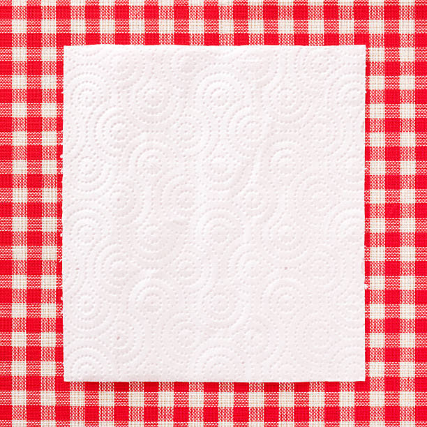 Paper napkin Top view of paper napkin over striped tablecloth paper towel photos stock pictures, royalty-free photos & images