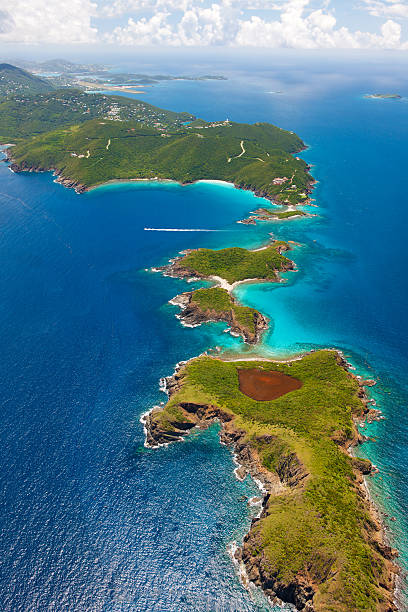 aerial shot of West End, St. Thomas, US Virgin Islands aerial shot of West End, St. Thomas in US Virgin Islands in the foregound, St. John, USVI and Tortola, BVI on the horizon; taken from a light aircraft st. thomas virgin islands photos stock pictures, royalty-free photos & images