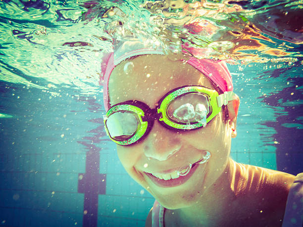 istock Underwater Young Girl Swimming 171580337