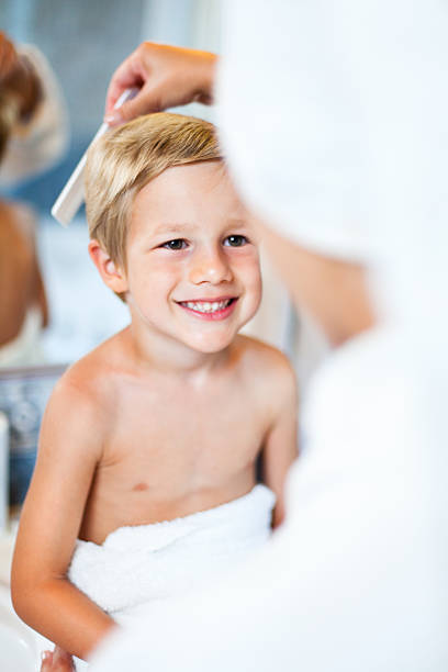 istock Mother combing son's hair 171580674