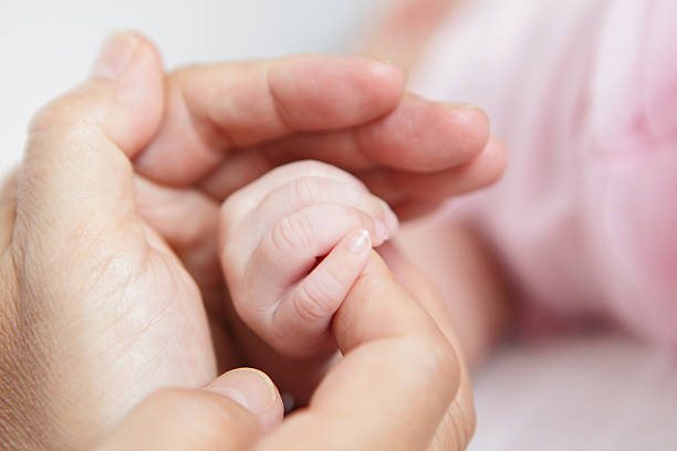 istock Closeup of baby hand 171580901