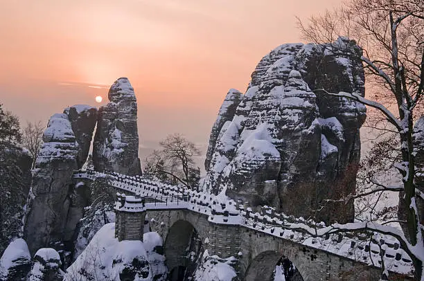 Sunrise in the Saxon Switzerland. Bastei bridge in winter, Germany