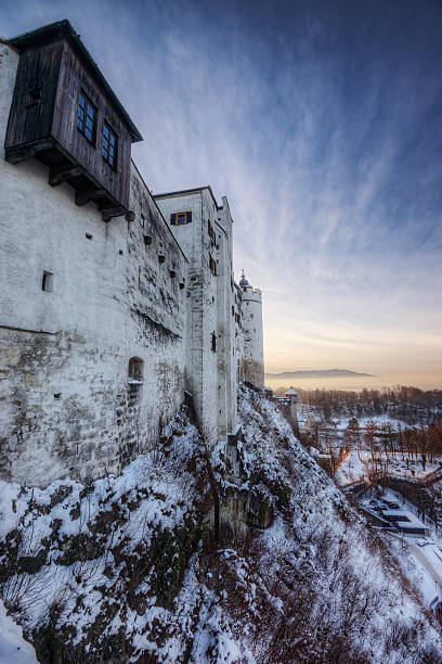 закат замок-зима - snow vertical wide angle lens hohensalzburg fortress стоковые фото и изображения