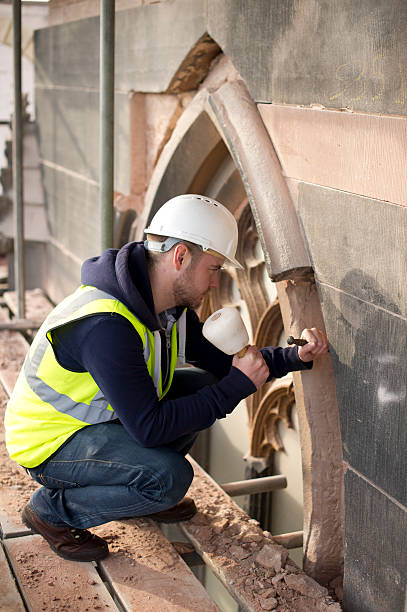 church stonemason stonemason on a church restoration architecture built structure building exterior church stock pictures, royalty-free photos & images