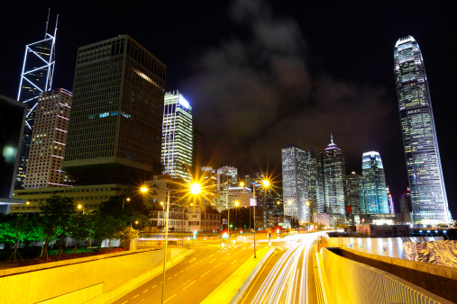 Hong Kong , modern city at night with traffic trails