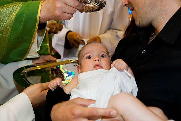 istock In church...Priest is baptizing little baby. 171581604