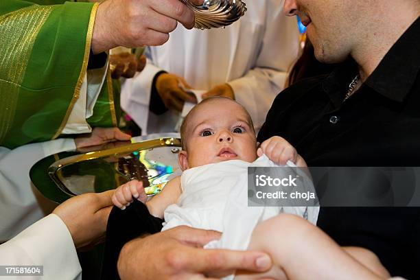 In Churchpriest Is Baptizing Little Baby Stock Photo - Download Image Now - Baptism, Catholicism, Baby - Human Age