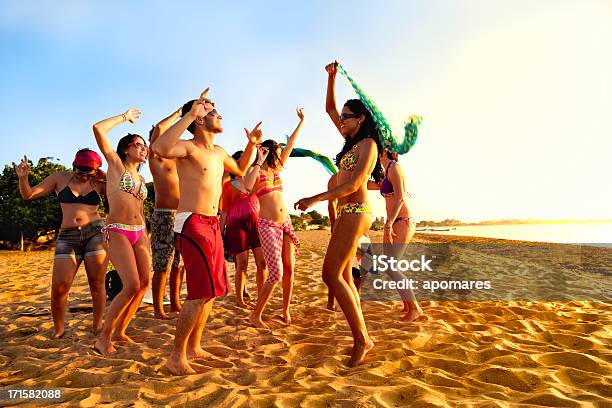 Group Of Young People At Tropical Beach Party Stock Photo - Download Image Now - Beach, Beach Party, Dancing
